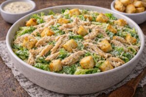 rotisserie chicken caesar salad with romaine parmesan croutons and dressing