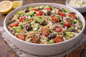 rotisserie chicken mediterranean salad with cucumber tomatoes olives and feta