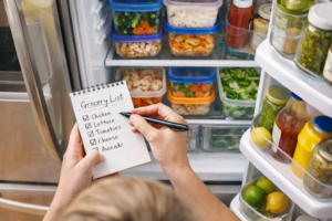 Checking ingredients in the fridge before grocery shopping to save money