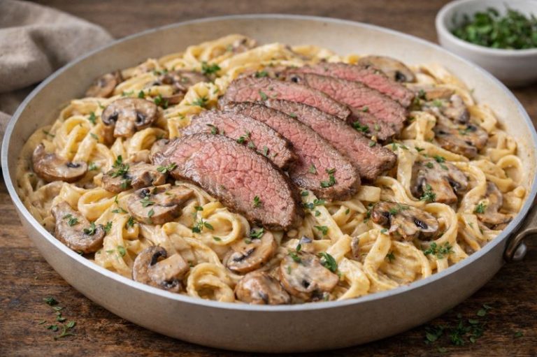 creamy mushroom pasta with sliced beef and thyme