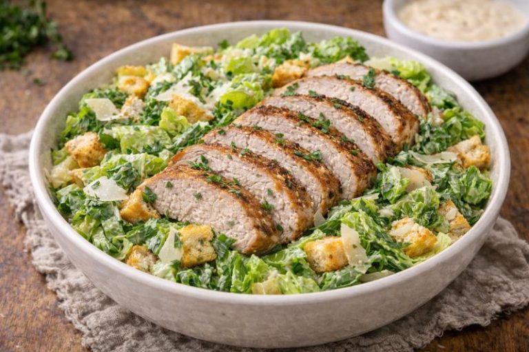 pork loin caesar salad with sliced pork romaine parmesan and caesar dressing