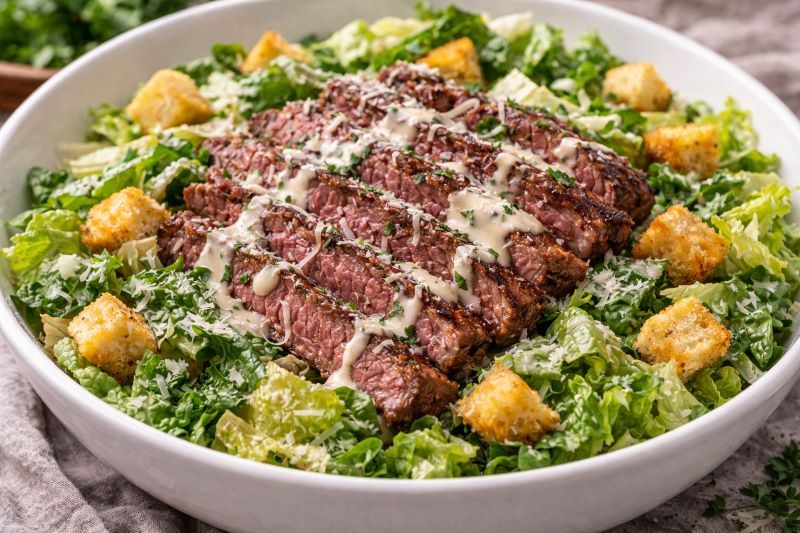 steak caesar salad with romaine parmesan croutons and dressing