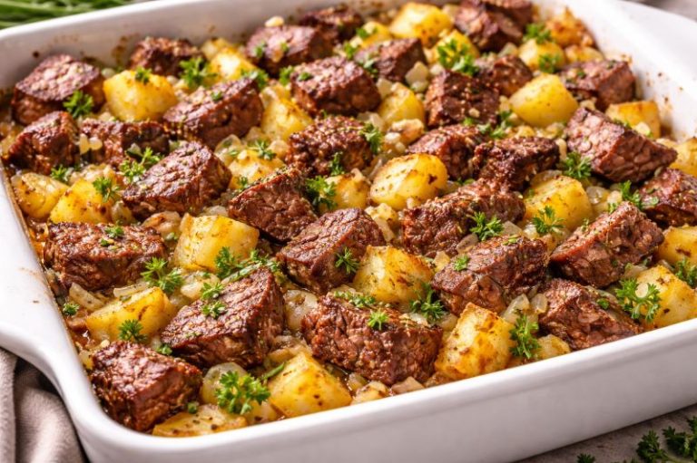 steak and potato casserole with onion garlic and parsley
